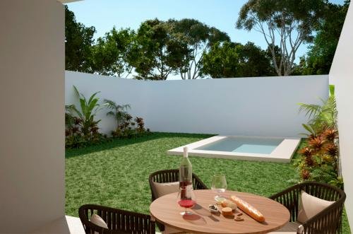 1018-29012-Casa-en-venta-de-un-piso-con-piscina-en-privada-Modelo-153-Cholul-_0007_1018-28990-V_-_Terraza-min.jpg